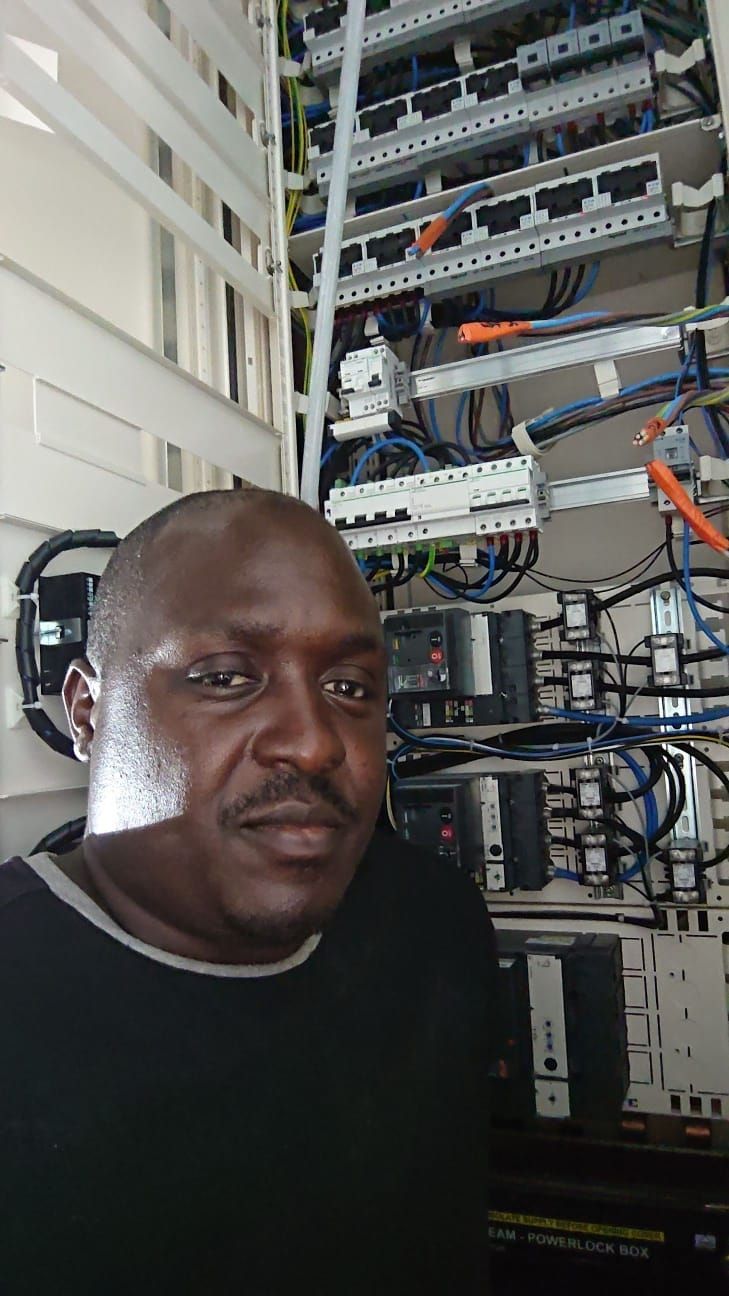 Technician with control panel and wiring